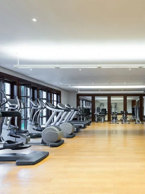 Gym with treadmills and wood floor